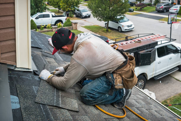 Professional Emergency Roof Repair technician working in Roosevelt, NY